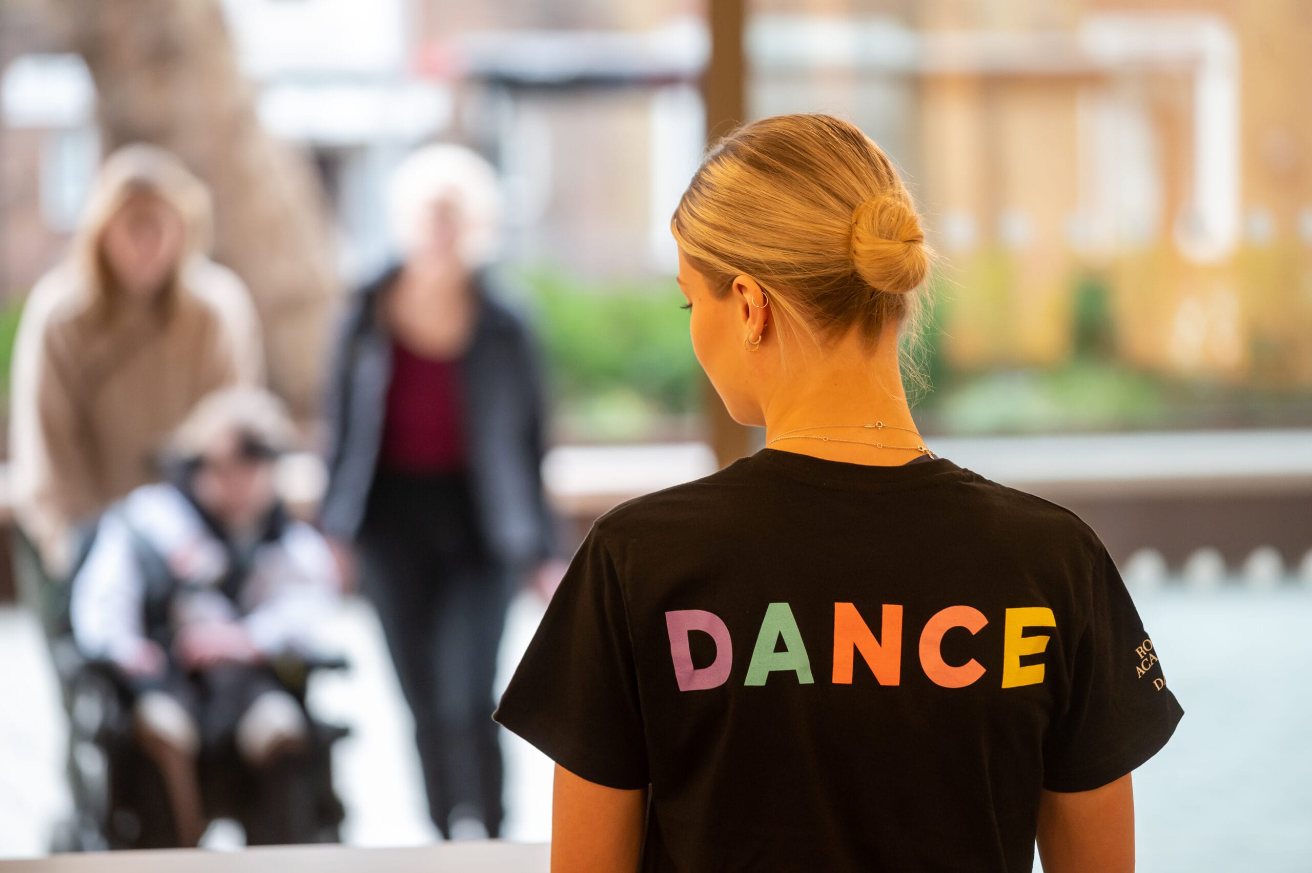 Image of Faculty of education student greeting guests from behind